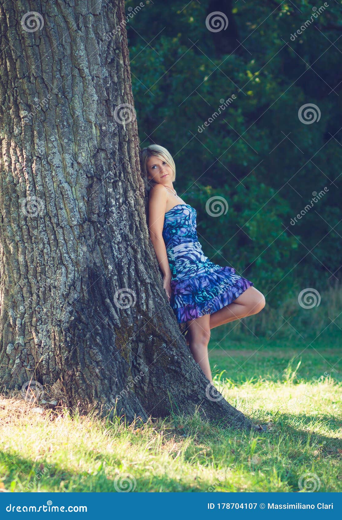 Portrait Of Fashionable Young Sensual Blonde Woman In Garden Lean On The Tree Stock Image 