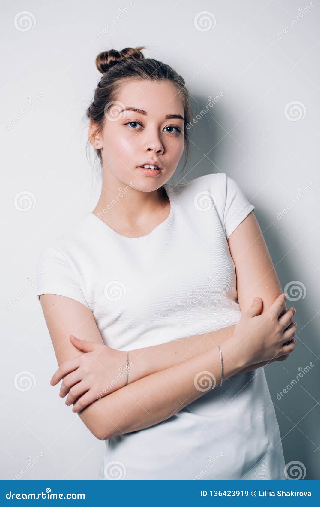 Portrait Of A Fashionable Young Woman On A White Stock Image - Image of