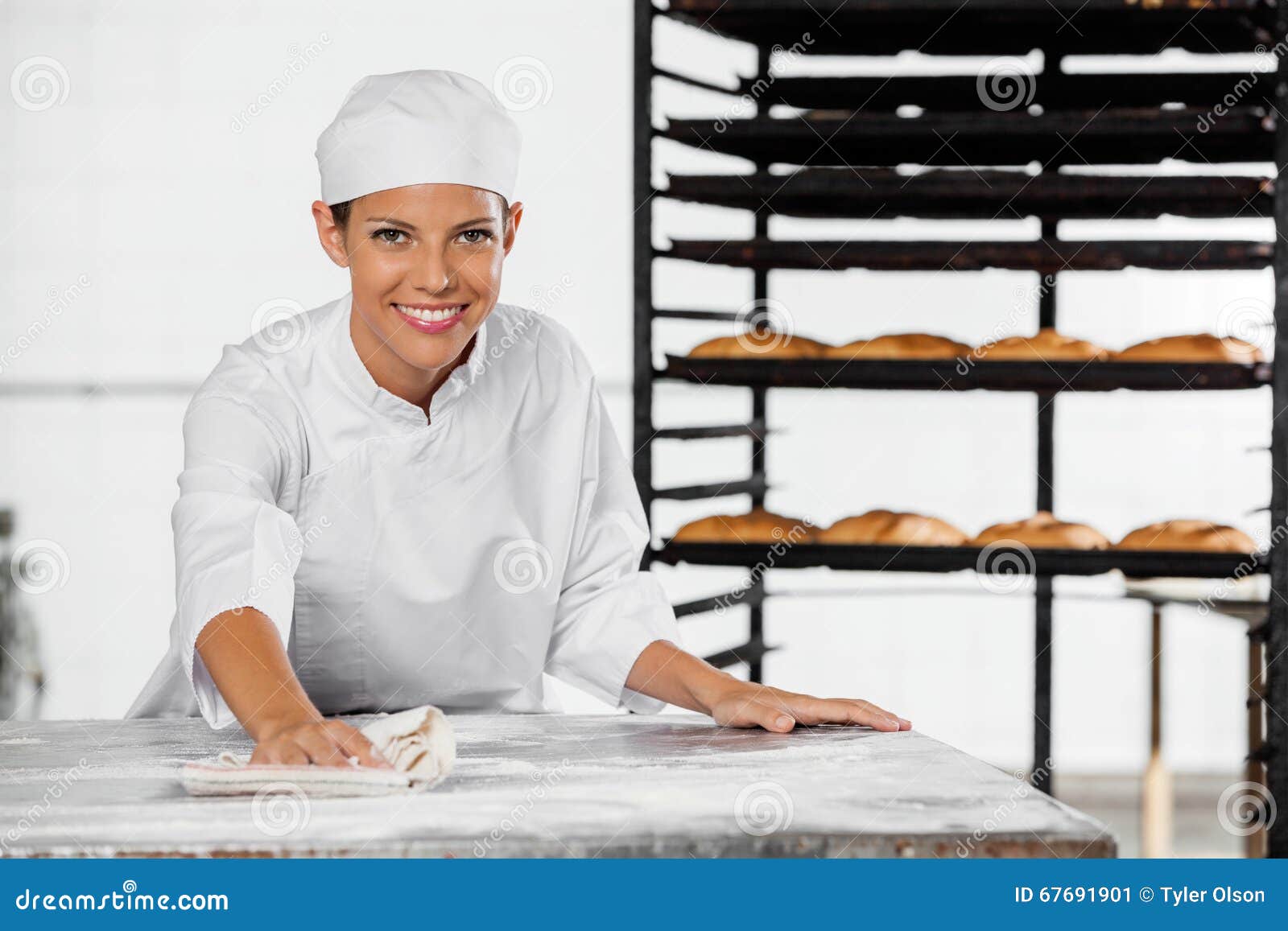 Portrait of Female Baker Cleaning Flour from Table Stock Image Image