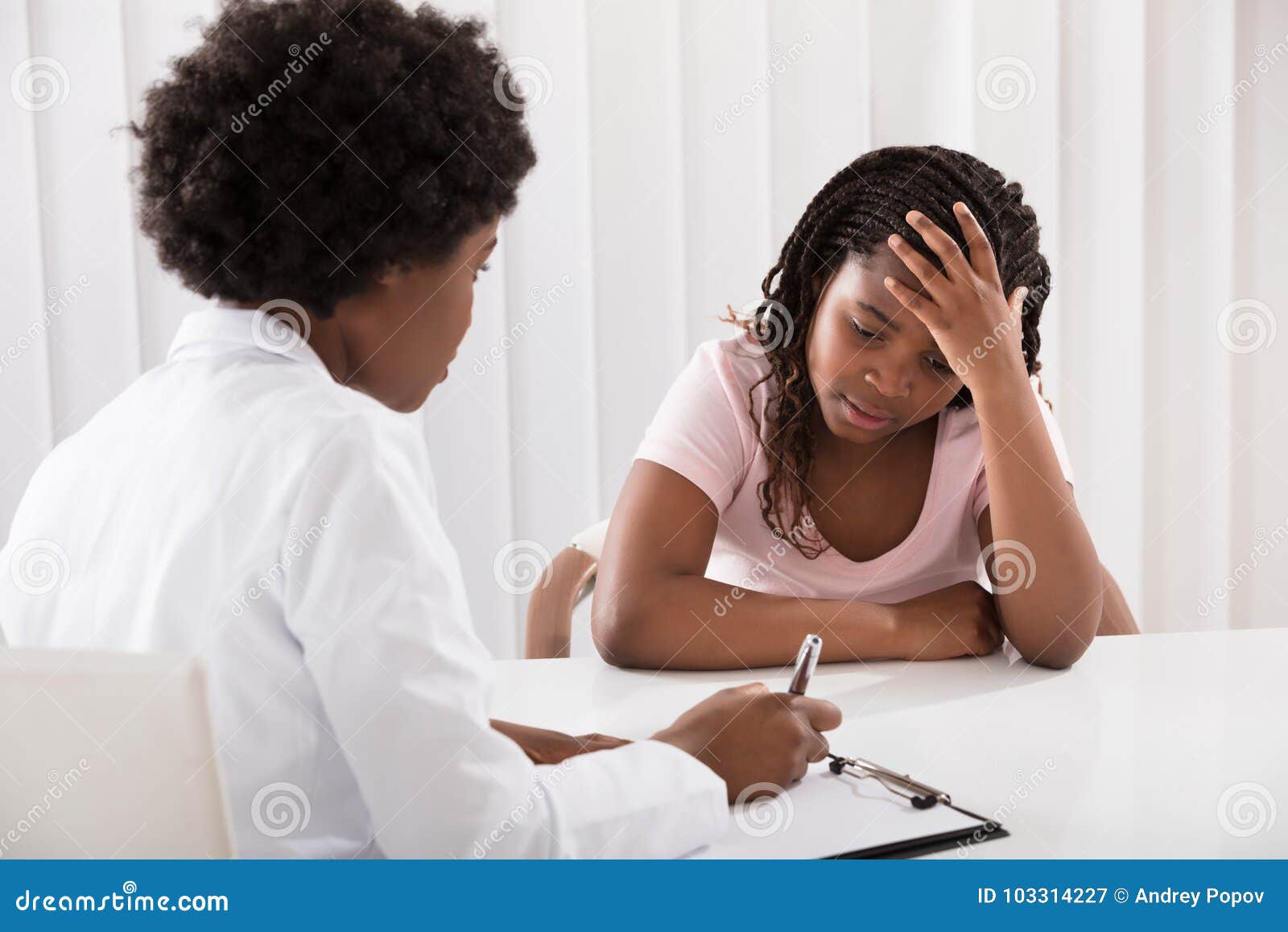 female doctor comforting depressed patient