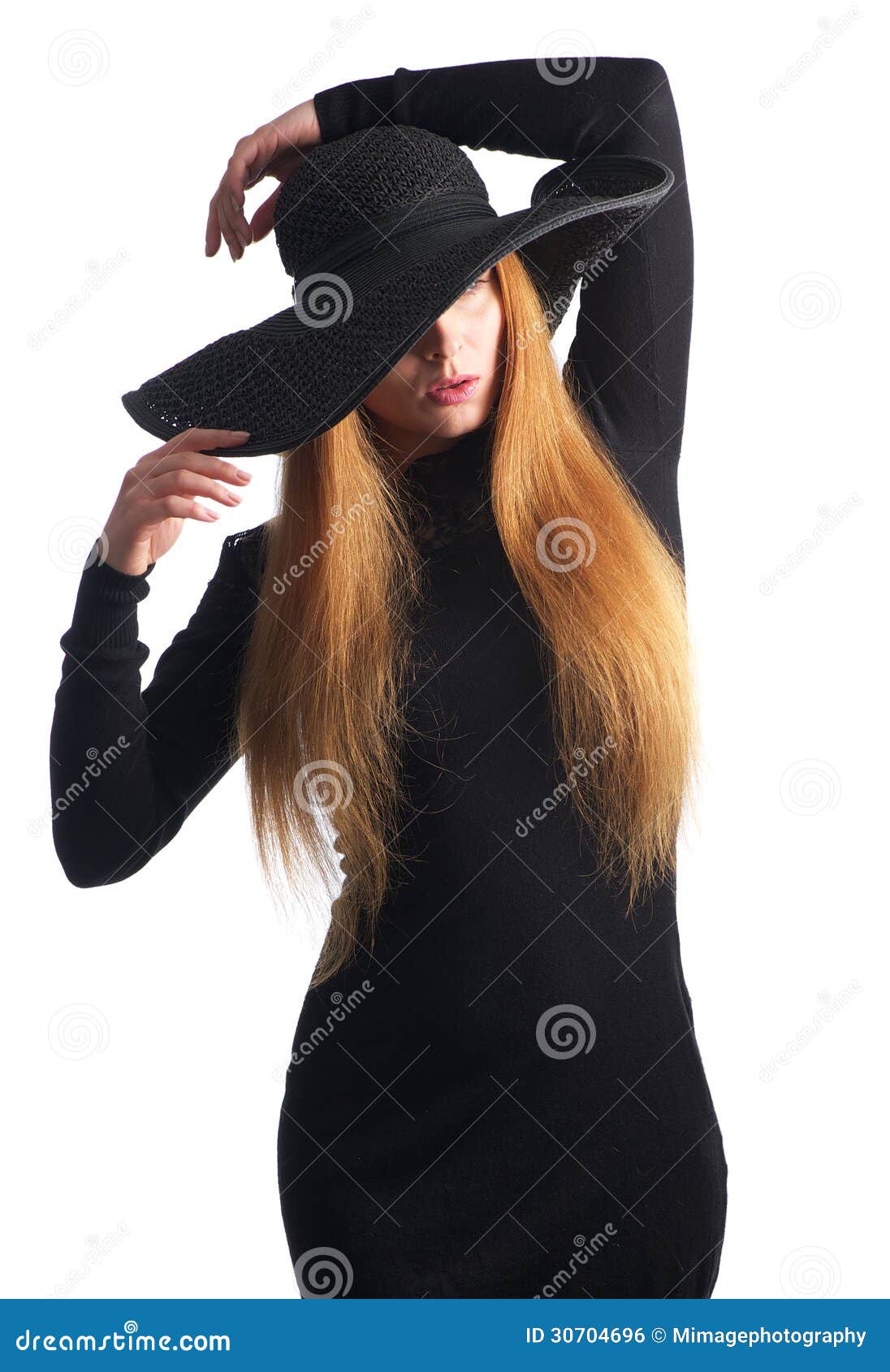 Portrait Of Female Fashion Model Posing In Black Hat 