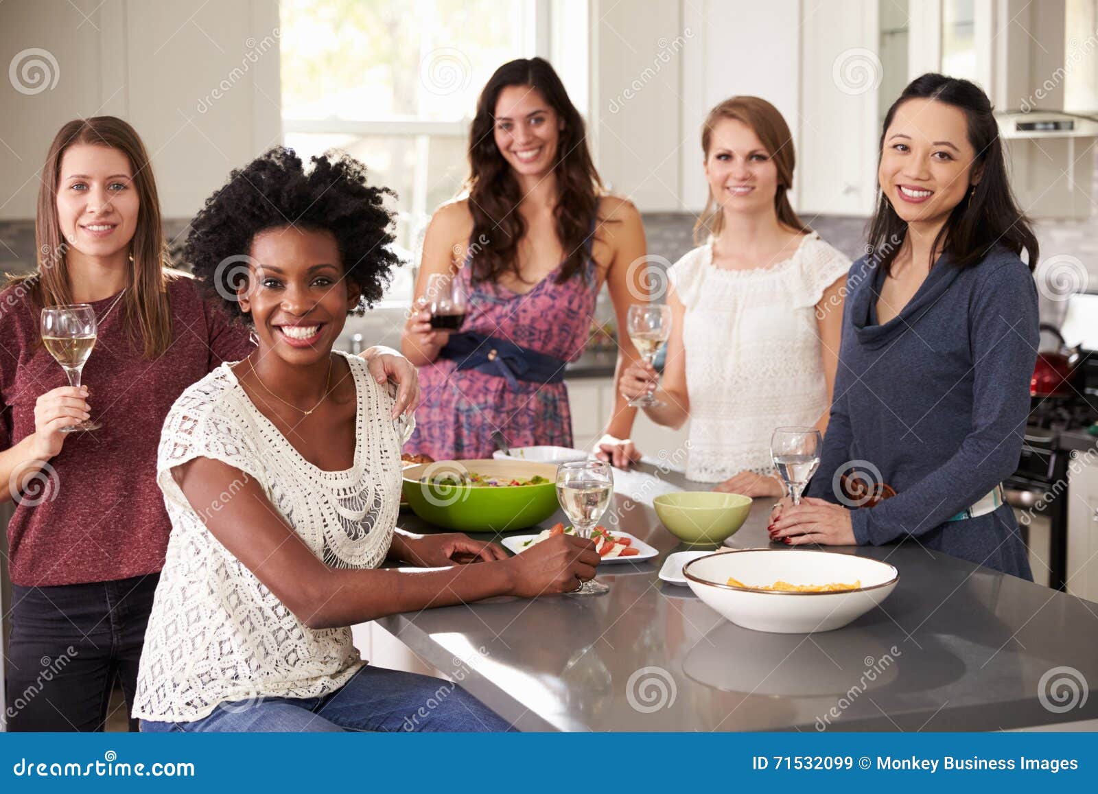 Portrait of Female Friends Enjoying Pre Dinner Drinks Stock Image