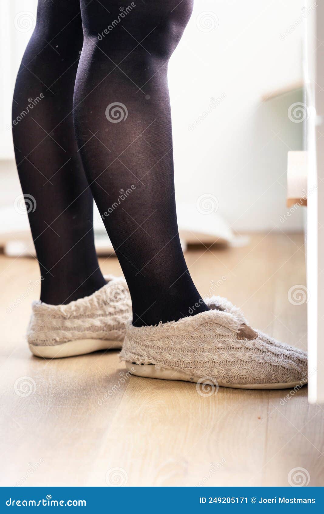 https://thumbs.dreamstime.com/z/portrait-female-legs-covered-black-nylon-stockings-pantyhose-wearing-slippers-mules-feet-standing-indoors-249205171.jpg