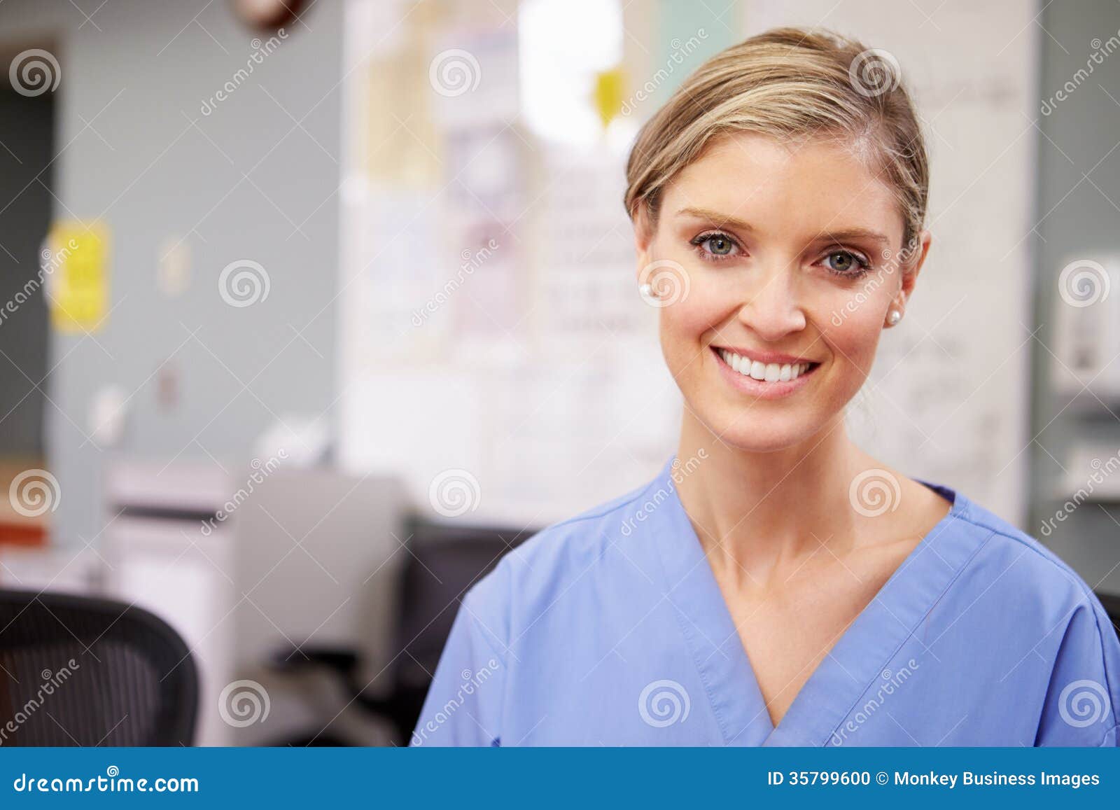Portrait of Female Nurse Working at Nurses Station Stock Photo Image