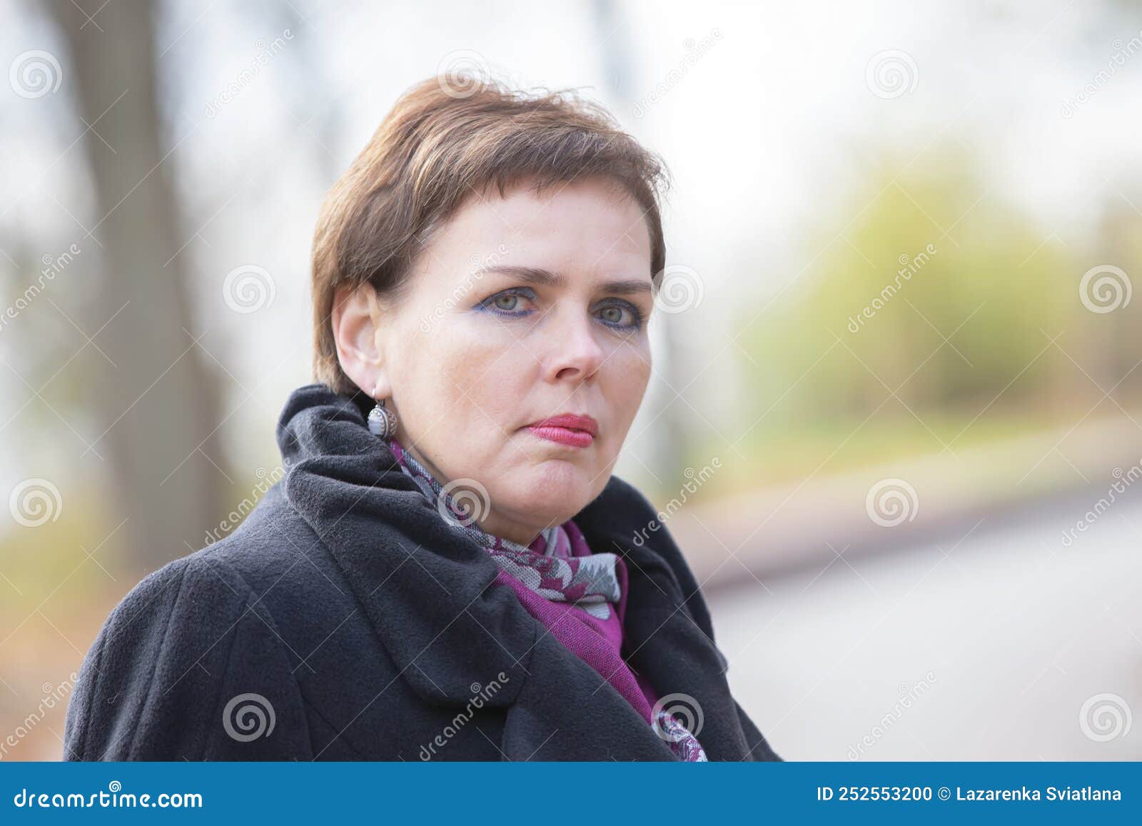 Portrait of a Fiftyyearold Woman with a Short Haircut Stock Photo
