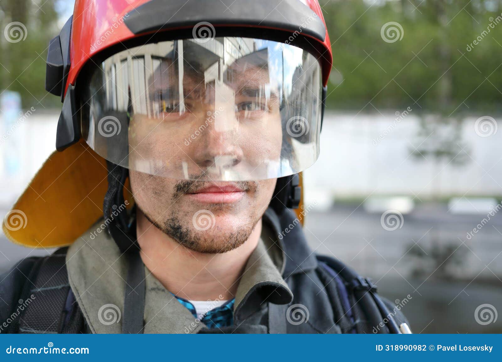 portrait of fireman wearing fire fighter turnouts