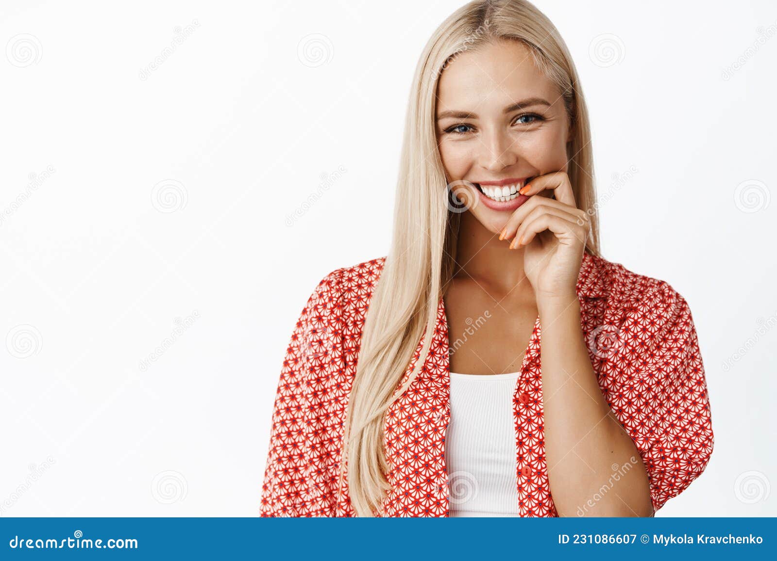 Portrait Of Flirty Feminine Blond Woman Biting Finger And Gazing