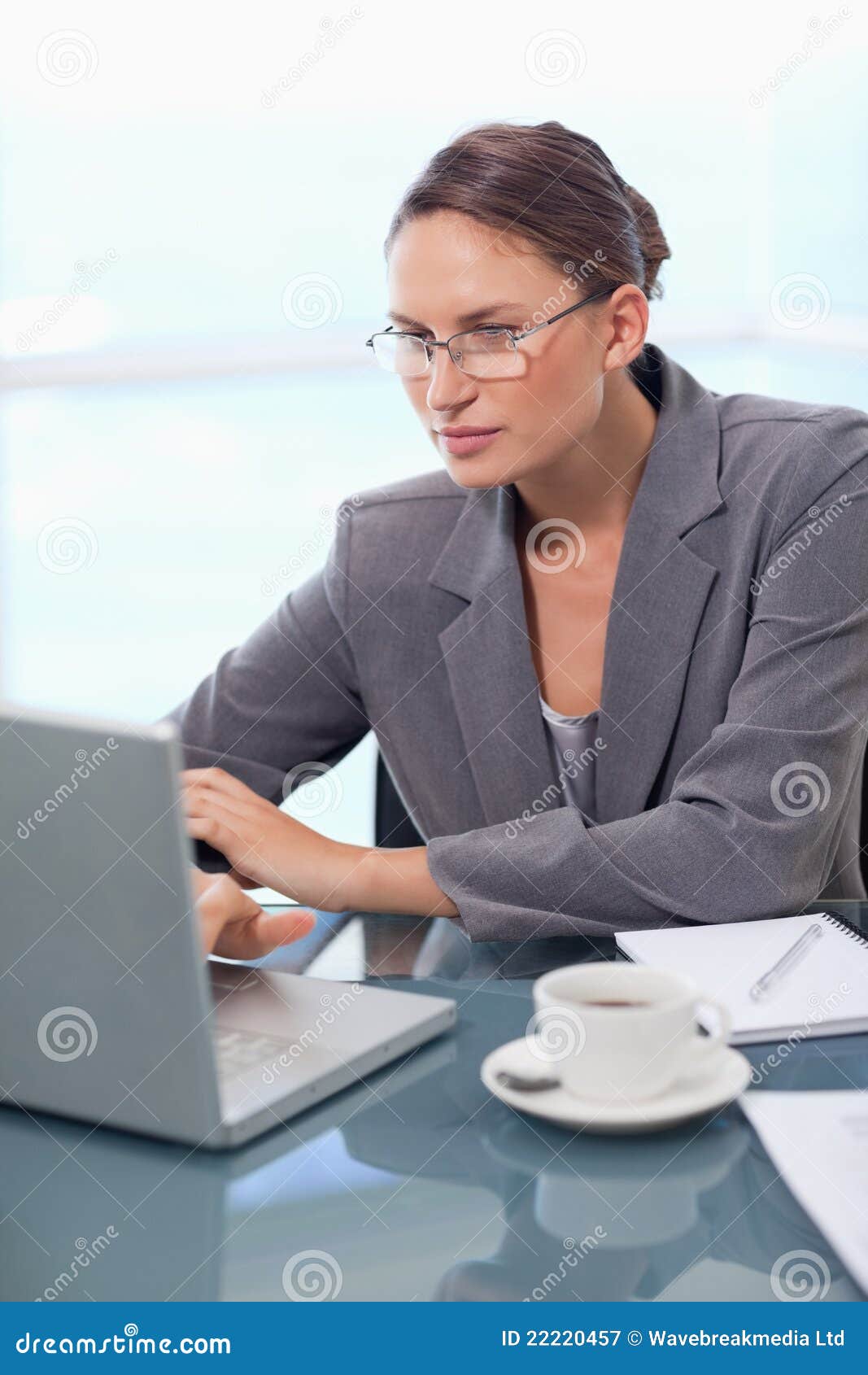 Portrait of a focused businesswoman using a laptop in her office