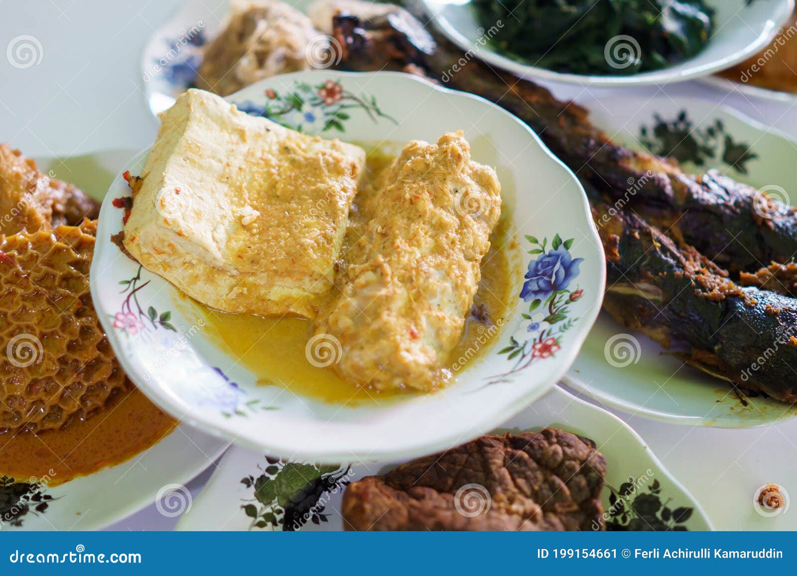 portrait food tofu tempeh yellow base on a plate