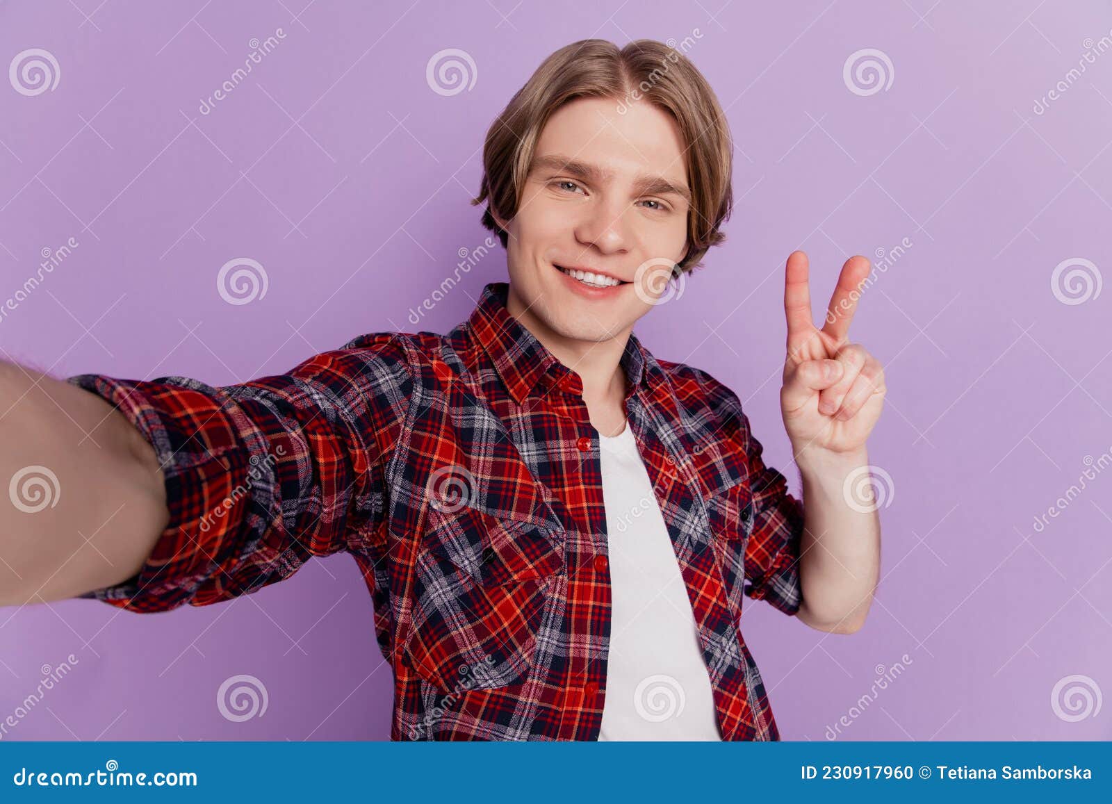 Portrait Of Friendly Positive Guy Shoot Selfie Toothy Smile Show Peace Gesture On Violet