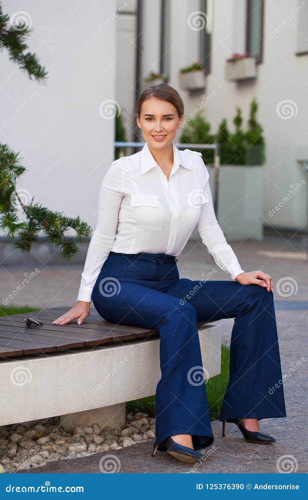 Young Woman Sitting on Bench in the Street Stock Photo - Image of girl ...