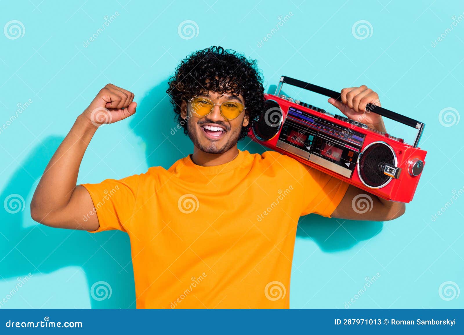 portrait of funky guy fist up listen vintage boombox summer discotheque chill sunglasses rayban  on aquamarine