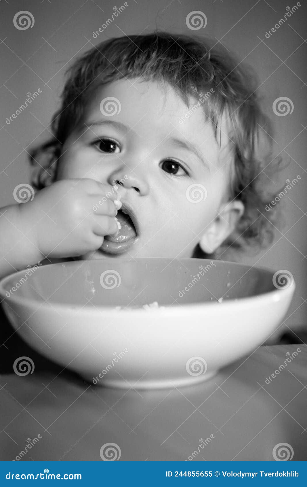 Portrait of Funny Little Baby Boy Eating from Plate Closeup. Stock ...