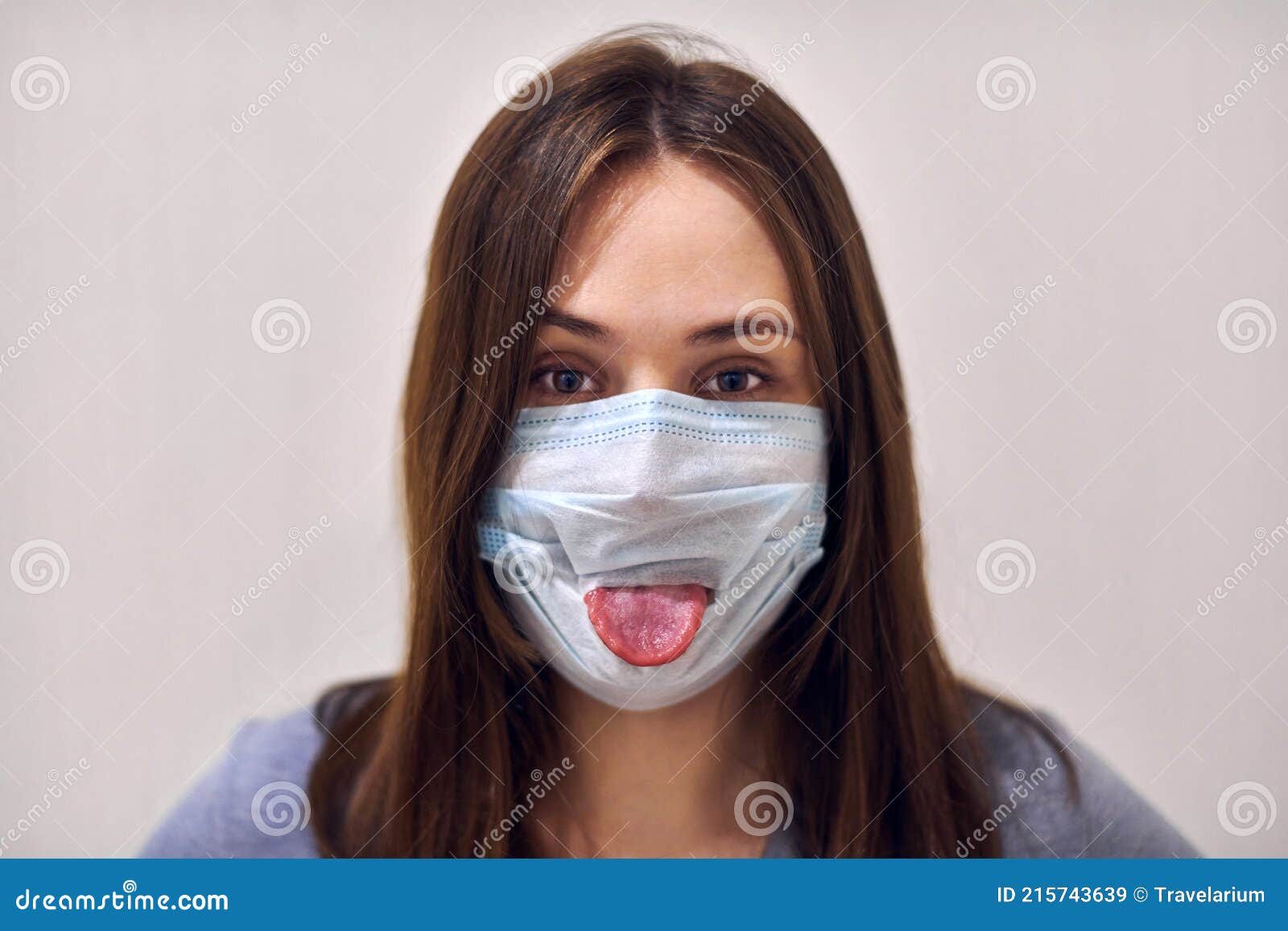 Funny Girl Wearing Surgical Mask and Showing Her Tongue Stock Image - Image  of happiness, female: 215743639
