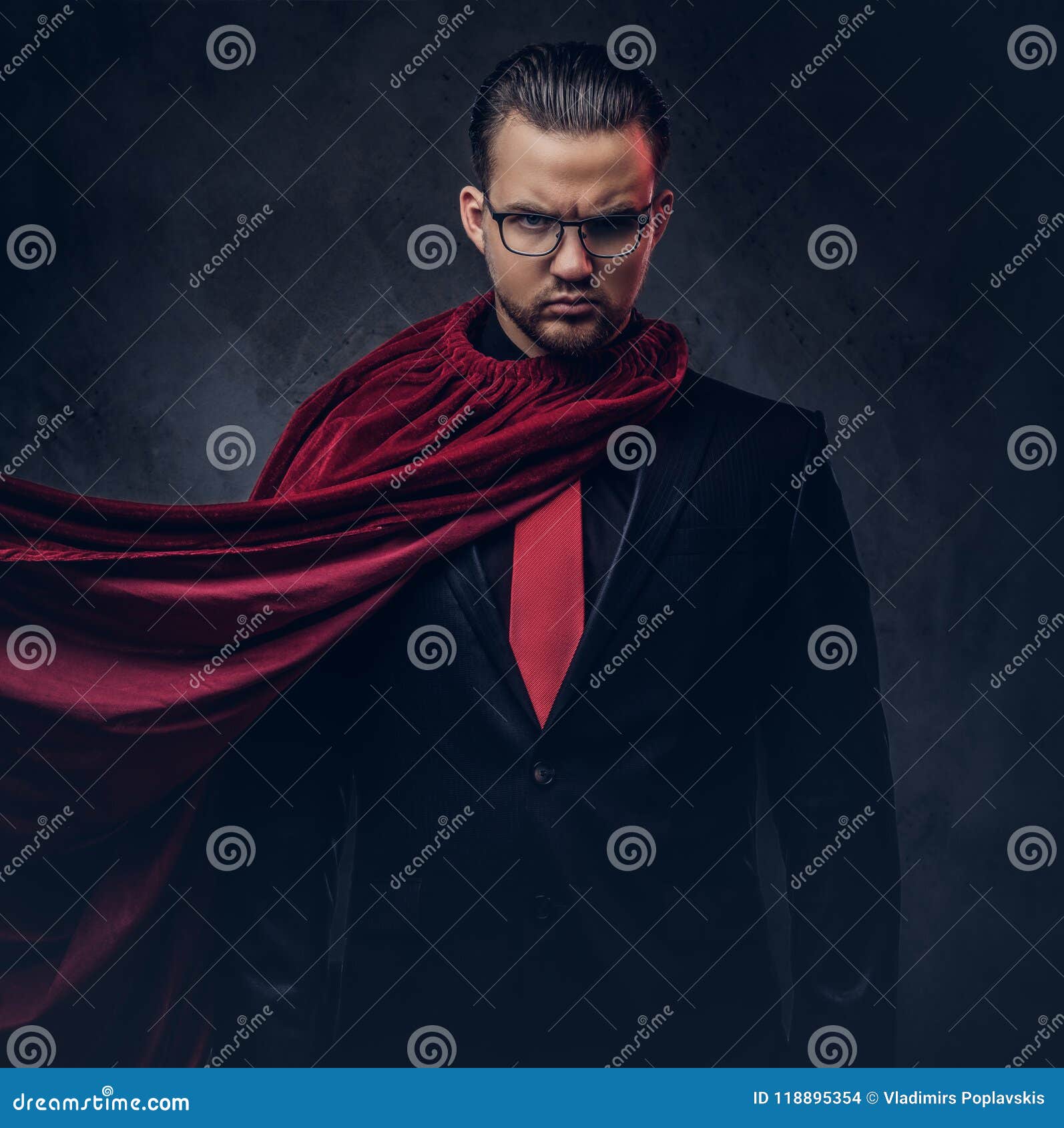 Portrait of a Genius Superhero in a Black Suit with a Red Tie on a Dark ...