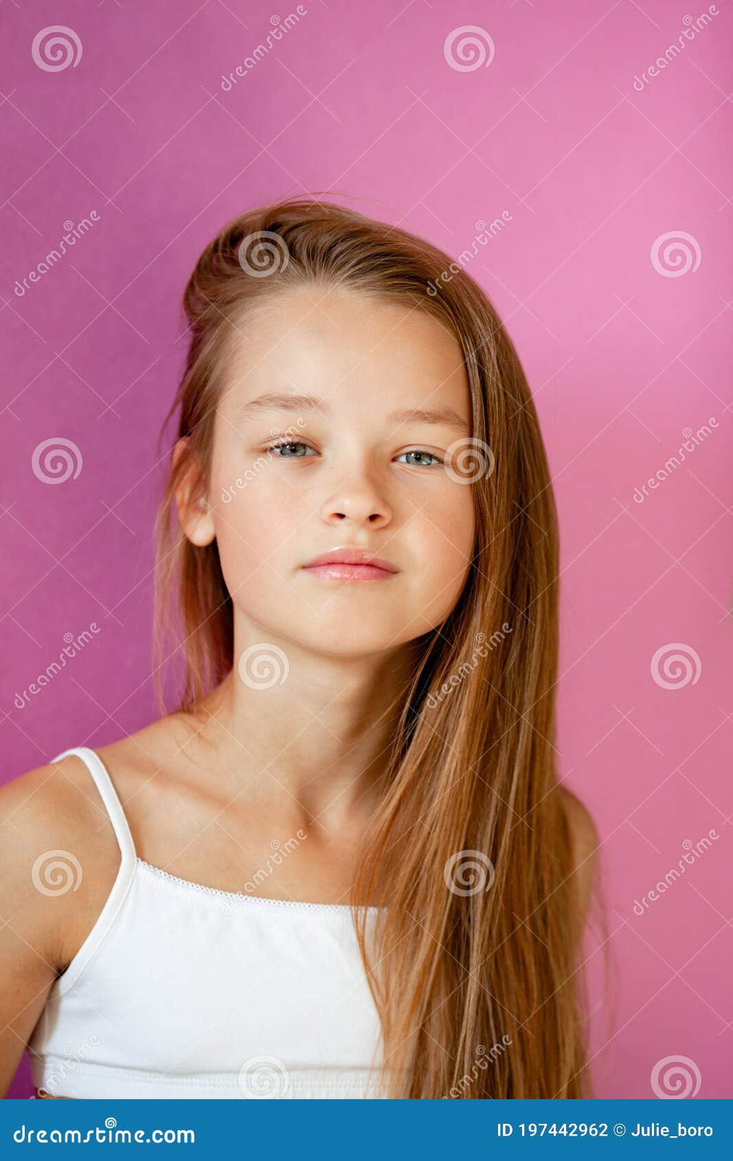 Portrait Of A Gentle 9 Year Old Long Haired Girl In A Light T Shirt