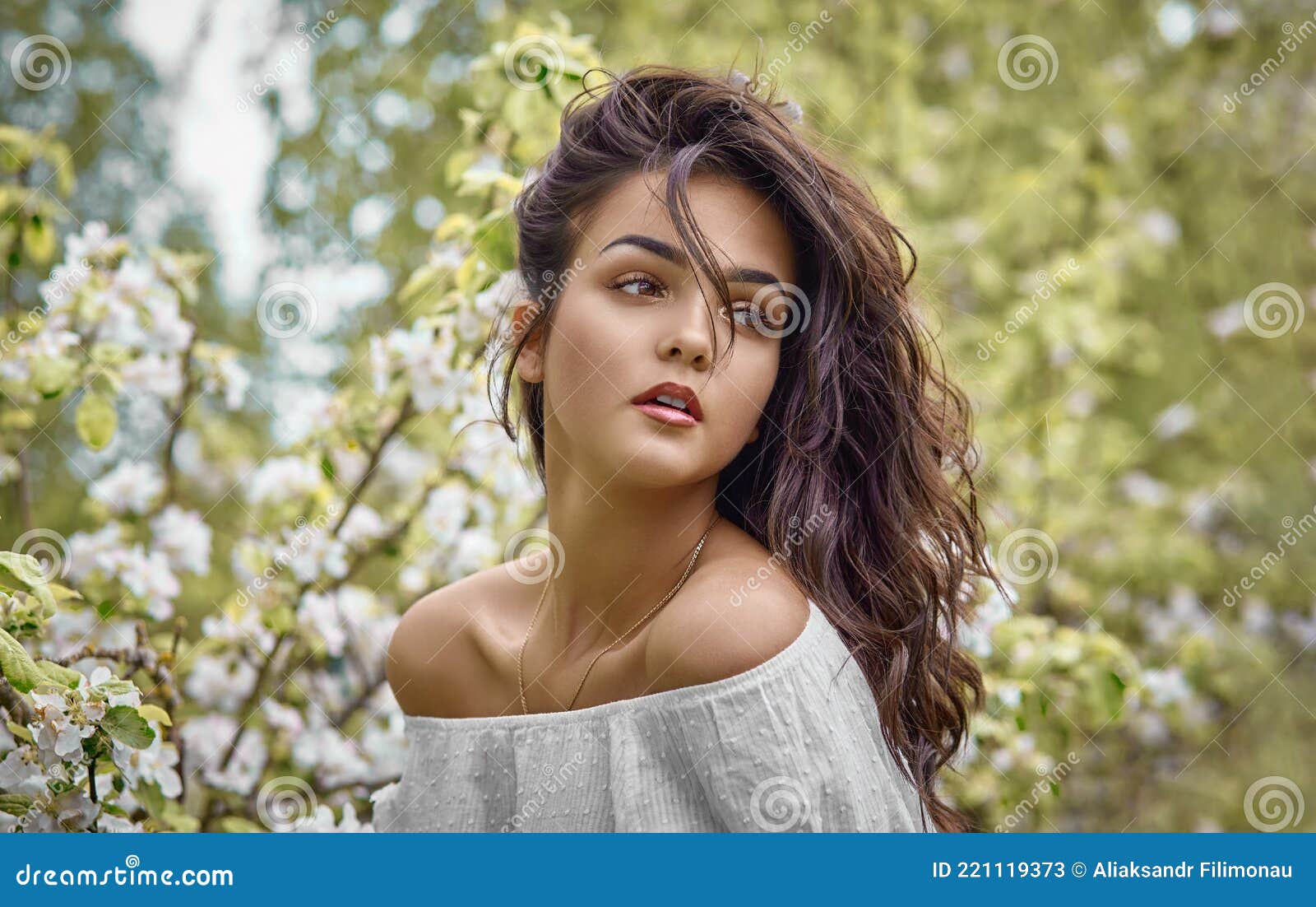 Portrait Of A Gentle Young Elegant Beautiful Girl In The Garden Near The Blossoming Apple Tree