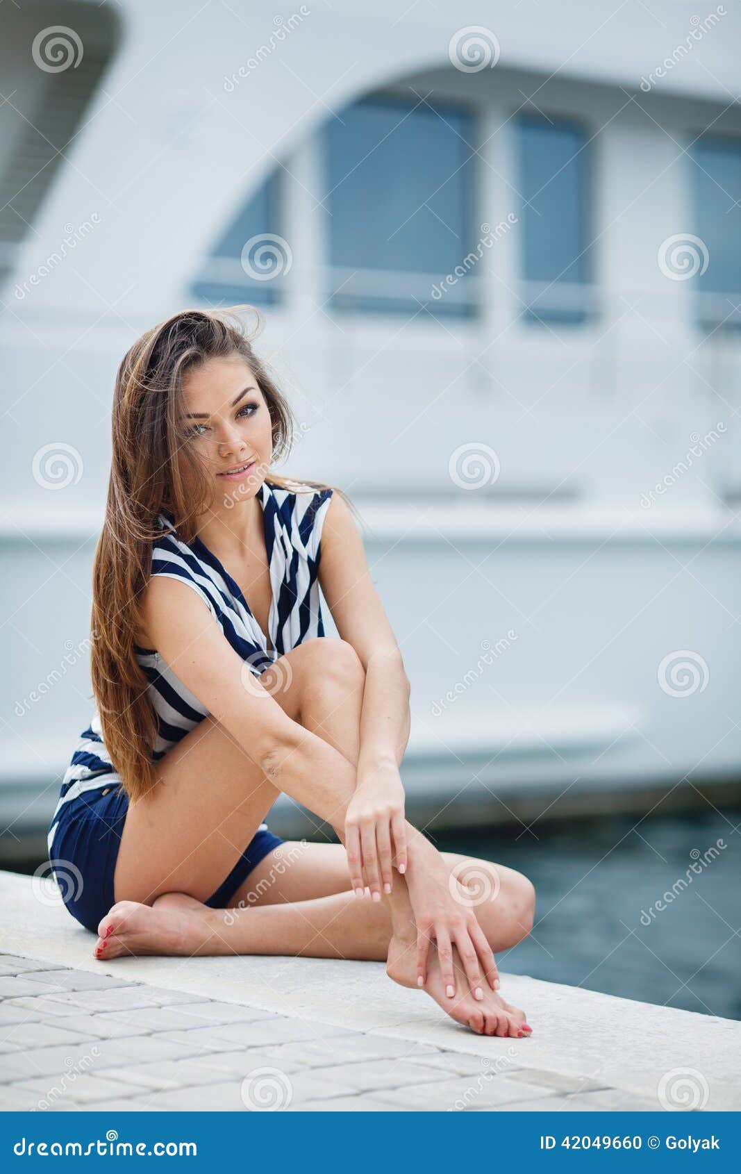 portrait of the girl against the sea and yachts stock
