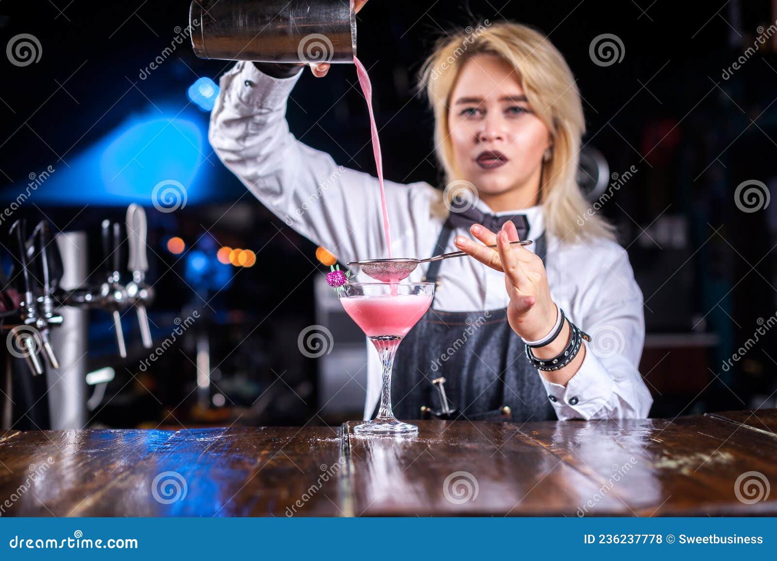 Portrait of Girl Barman Places the Finishing Touches on a Drink at Bar ...