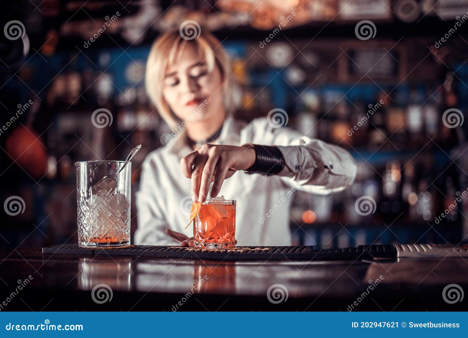 Portrait of Girl Bartender Demonstrates the Process of Making a ...