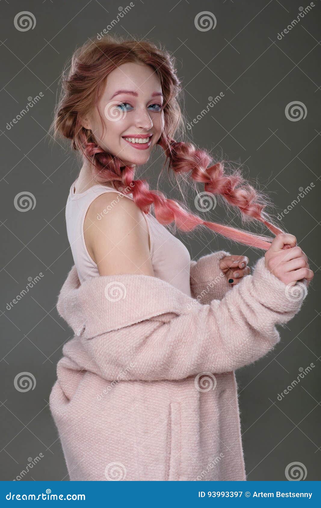 Portrait Of A Girl With Pink Hair In Braids With Blue And Pink