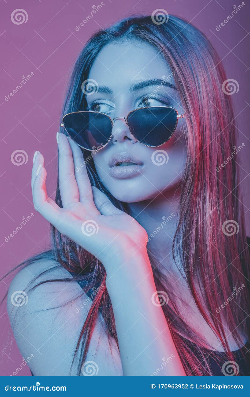 Portrait of a Girl in Sunglasses. Model Shot in the Studio with ...