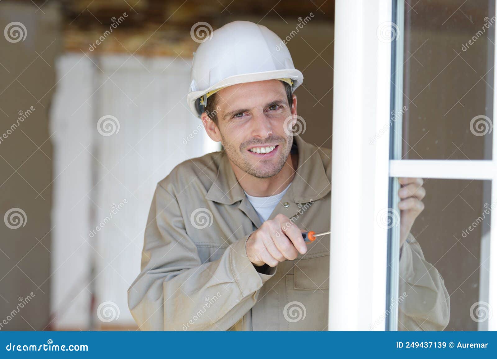 Glazier Using Application Gun To Apply Adhesive For Windscreen Stock