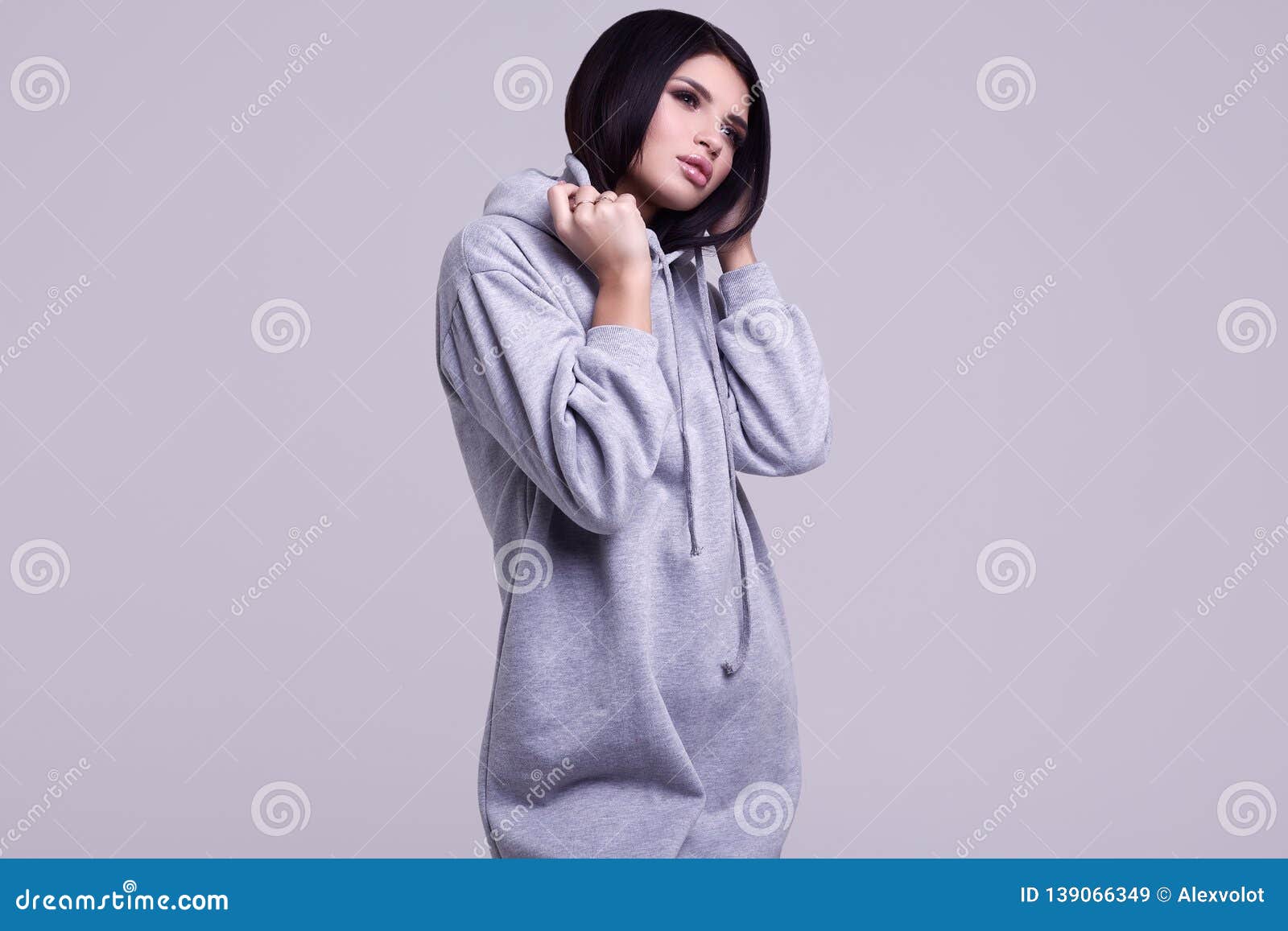 Gorgeous Brunette Woman in Fashion Blue Hoodie in Studio Stock Image ...