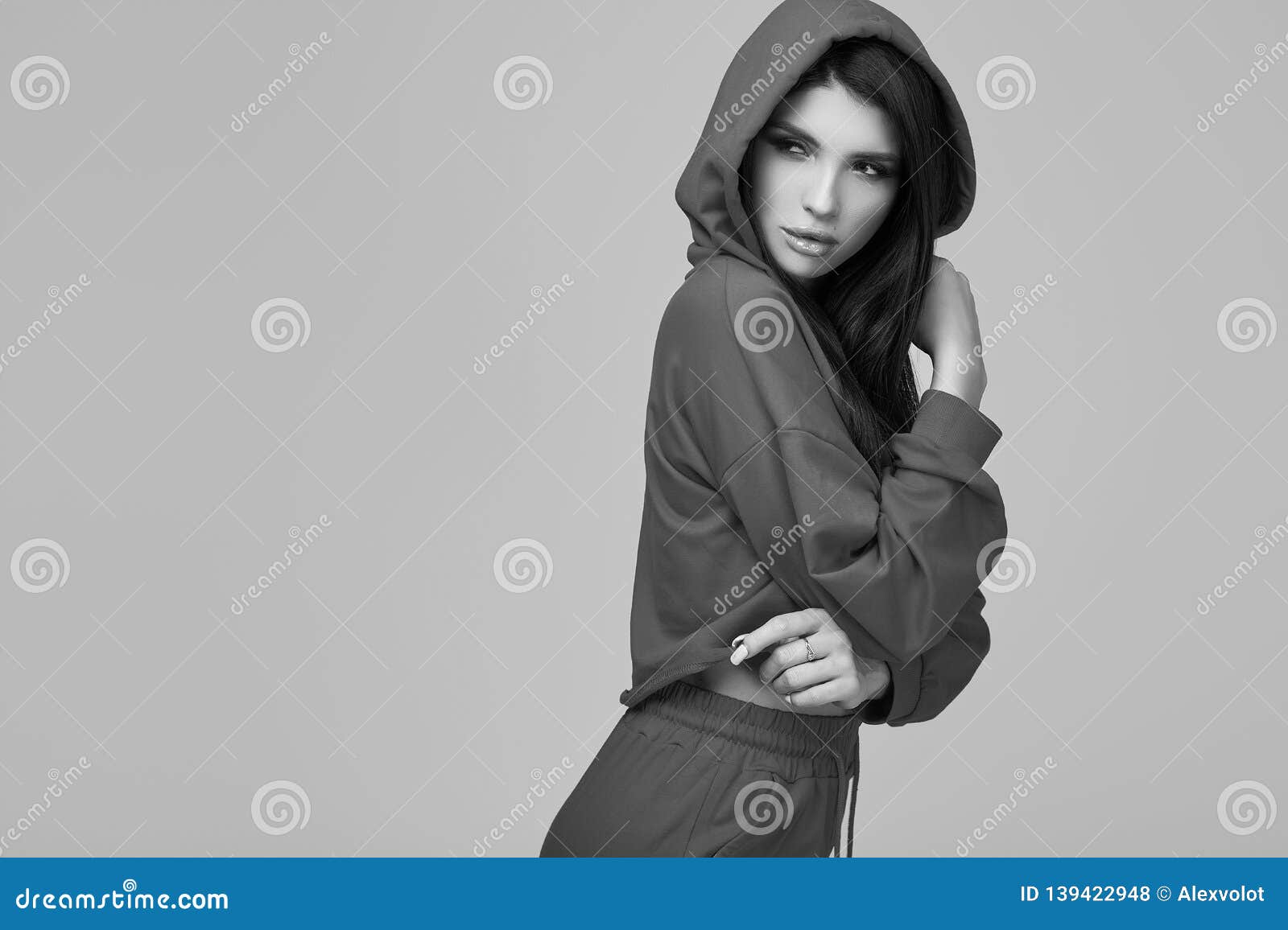 Gorgeous Brunette Woman in Fashion Red Hoodie in Studio Stock Photo ...