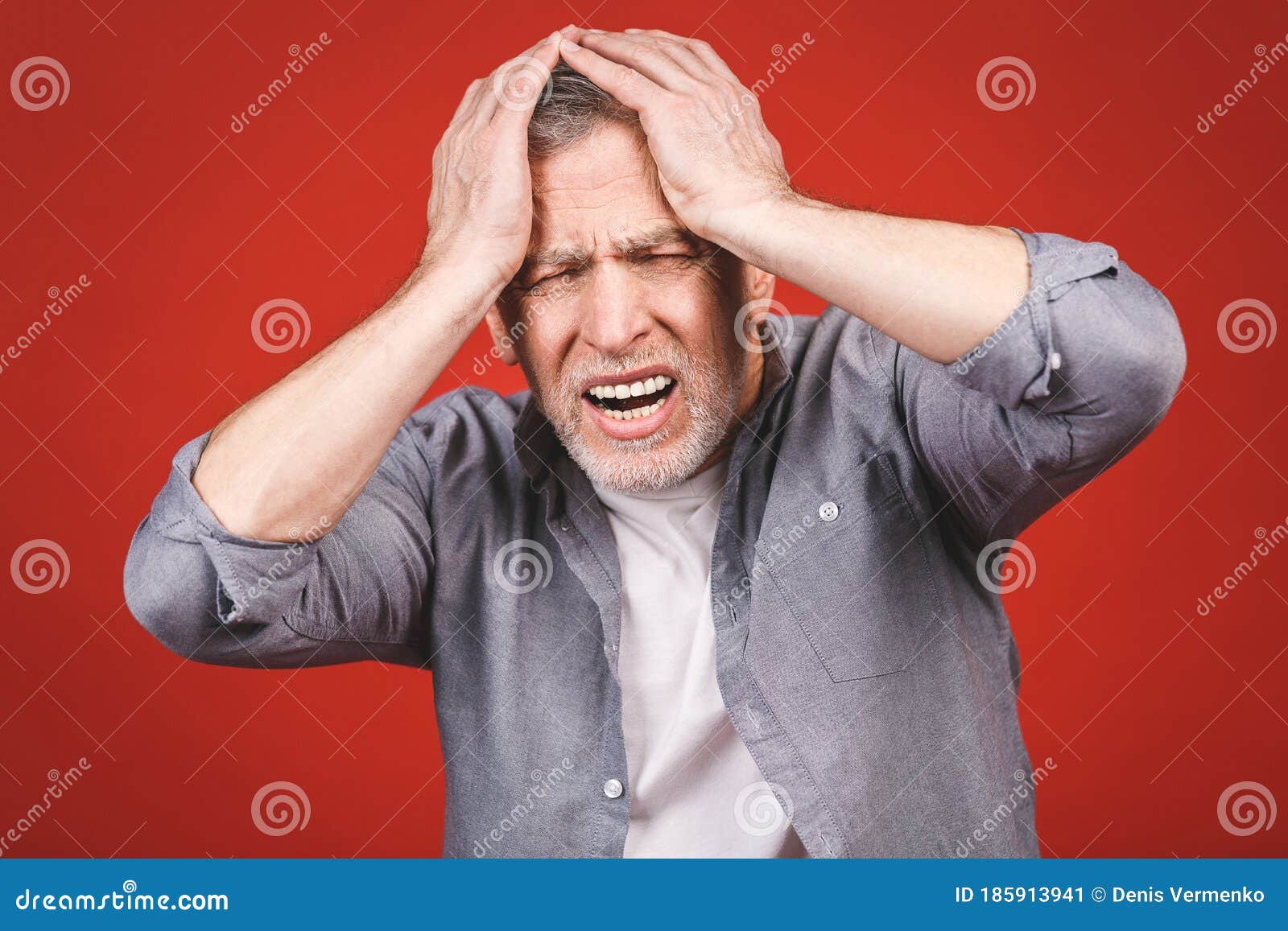 portrait of a groggy upset worried sad, depressed, tired senior man with a headache, very stressed,  on red background,