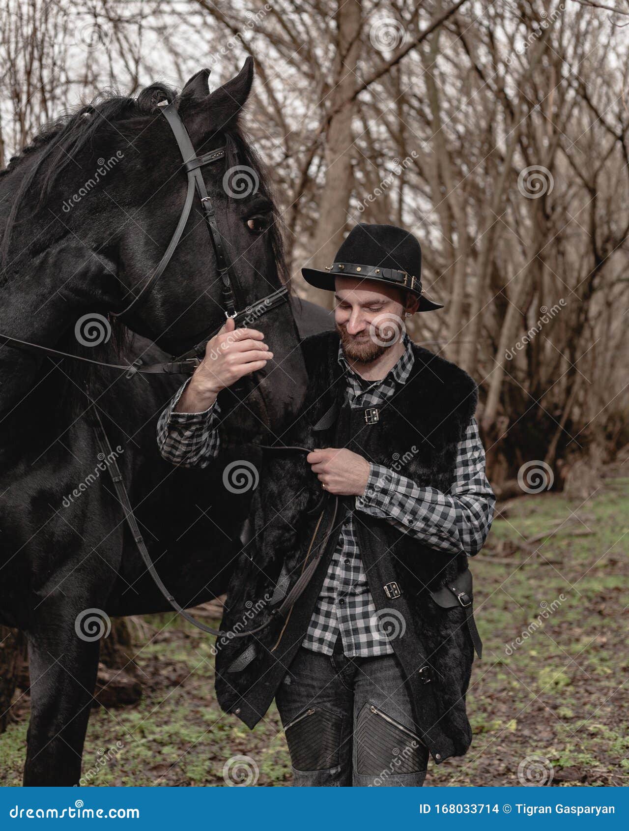 Portrait of a Guy in a Hat with a Black Horse Stock Photo - Image of ...