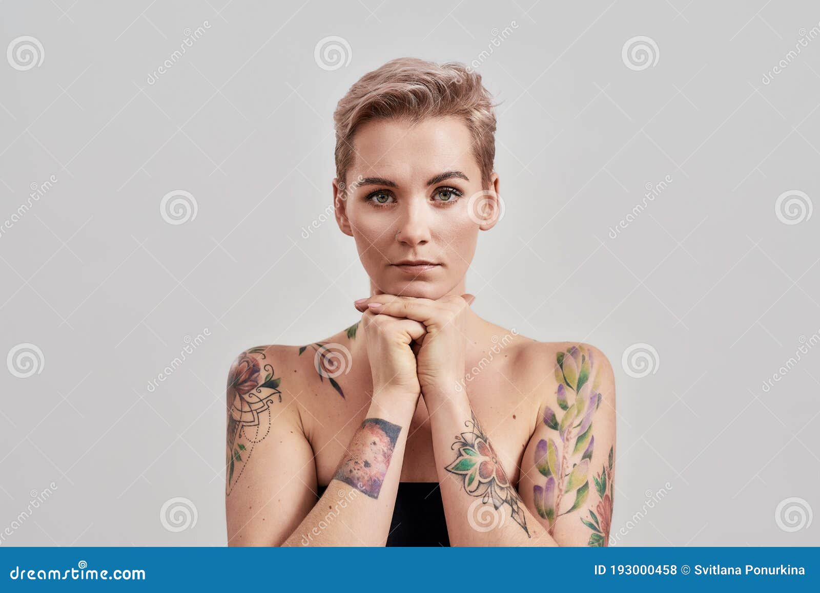 Well Portrait Of A Young Attractive Half Naked Tattooed 