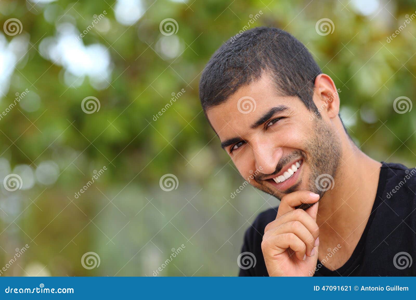 portrait of a handsome arab man face outdoors