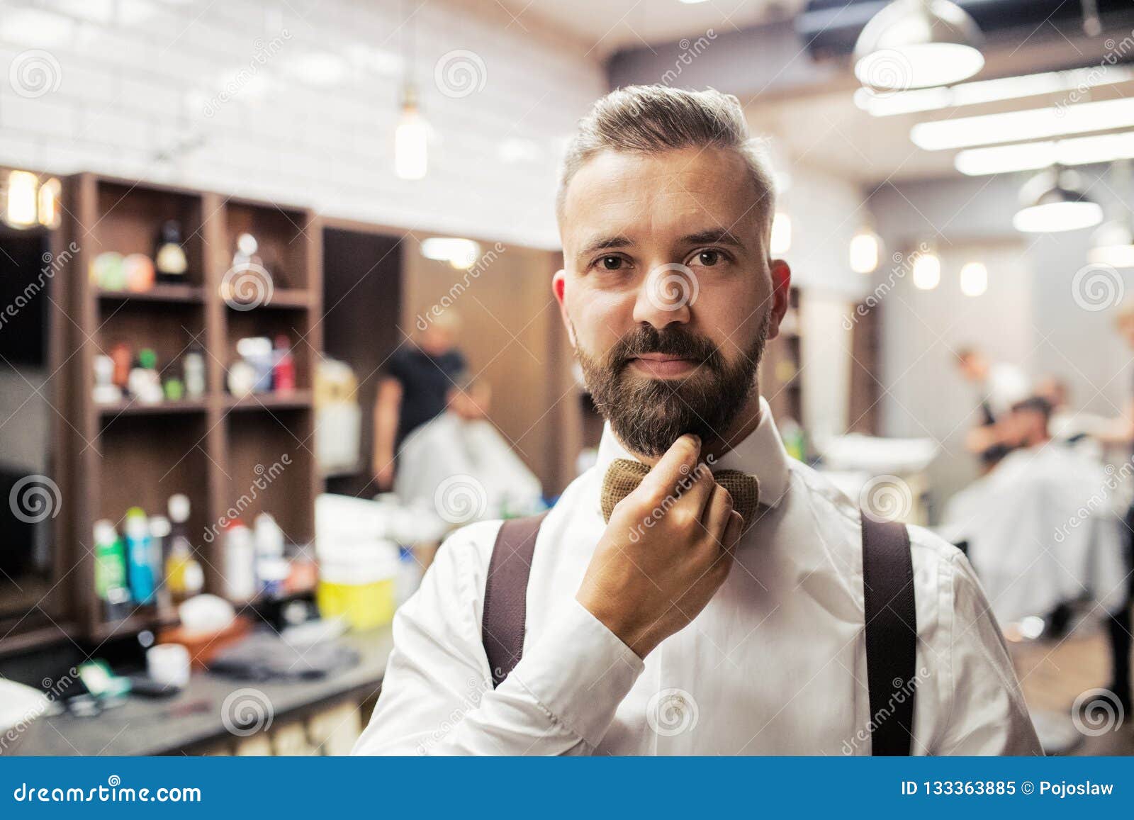 A Portrait of Handsome Hipster Man Client Standing in Barber Shop ...