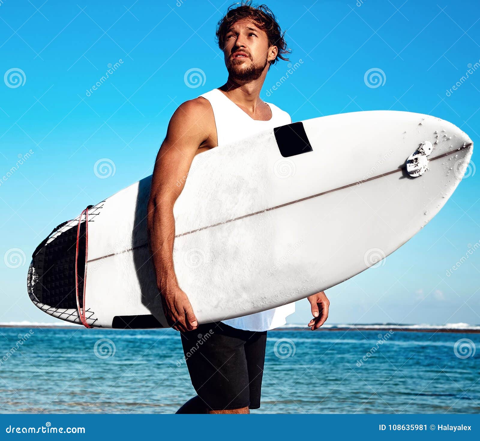Model Surfer Wearing Casual Clothes Going with Surfboard on Blue Ocean ...