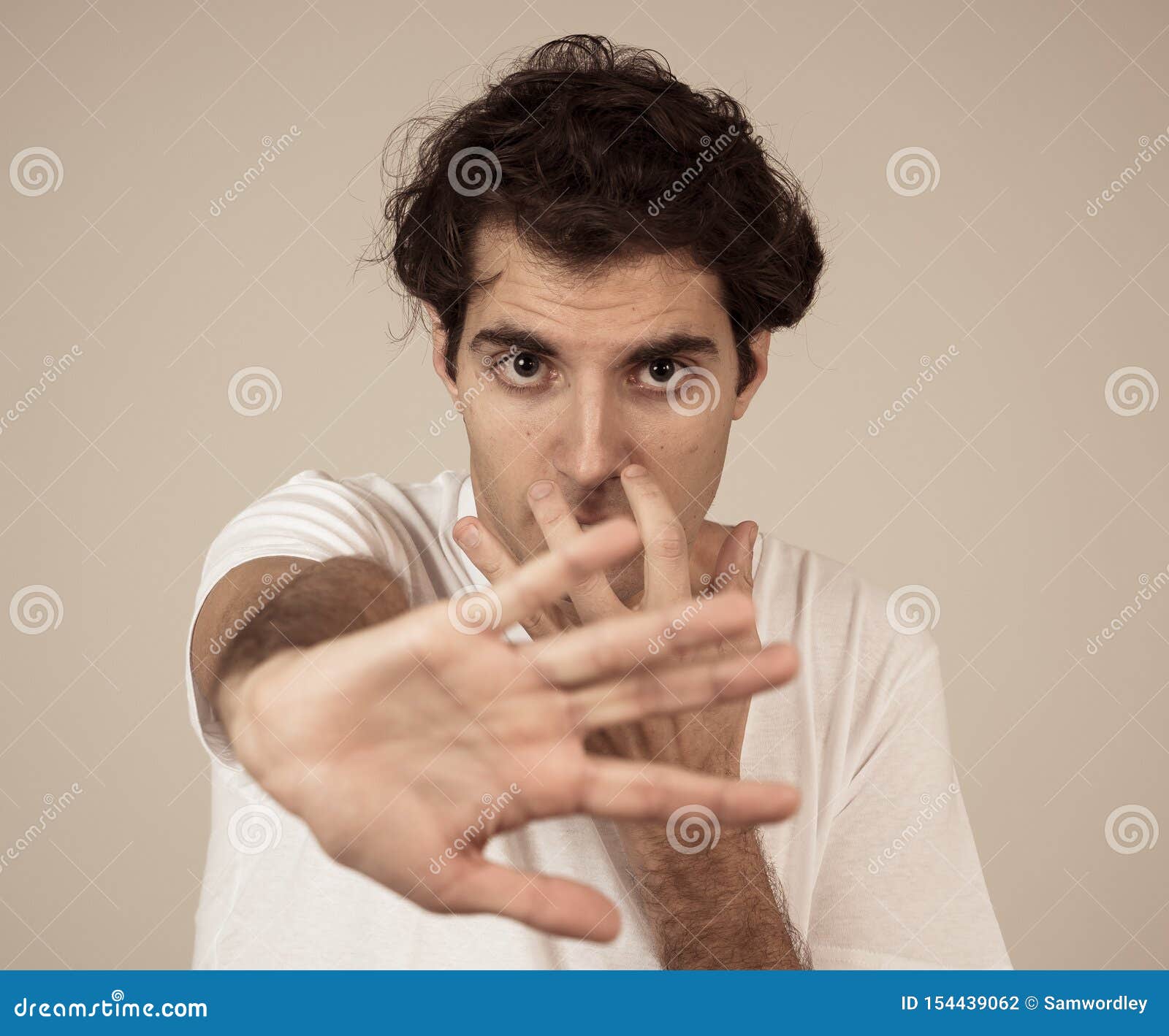 Portrait Of Young Man In Shock With A Scared Face Expression