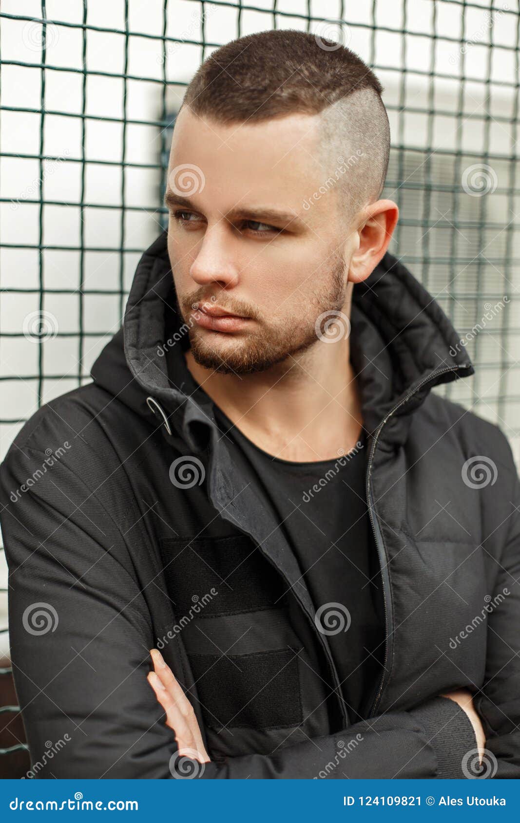 Handsome man with modern hairstyle smiling in urban background 5889346  Stock Photo at Vecteezy