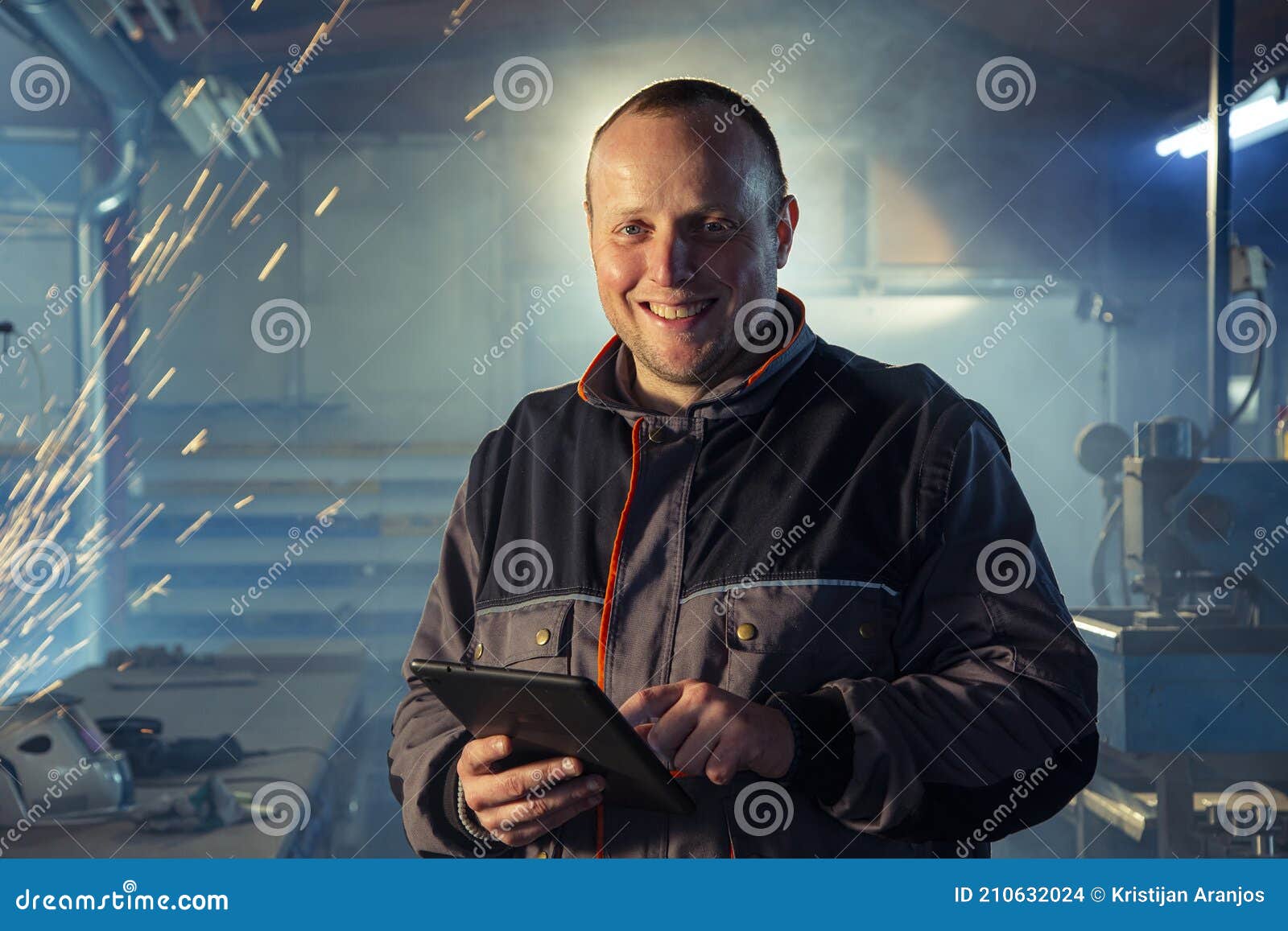Portrait of the Handyman Welder with a Tablet in Stock Photo