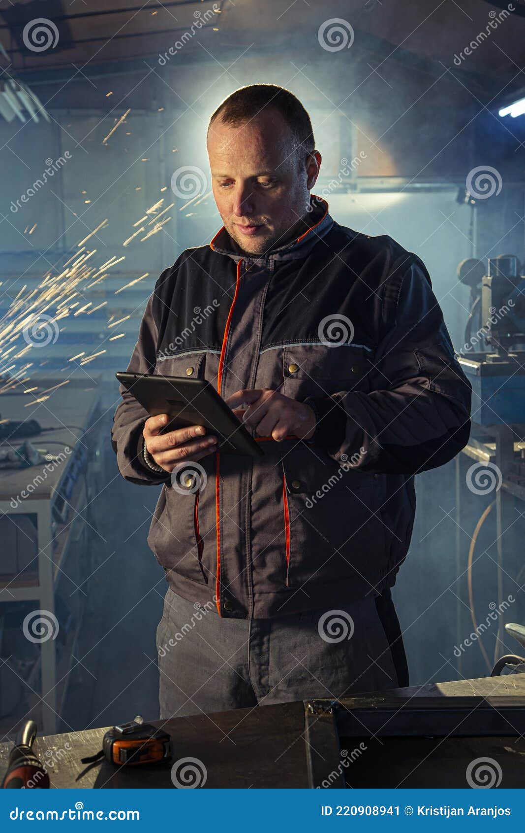 Portrait of the Handyman Welder with a Tablet in Stock Image