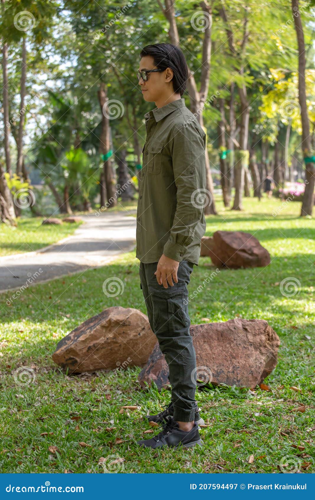 Portrait of Happy Asian Young Man in Long Sleeve Shirt and Green Pant ...