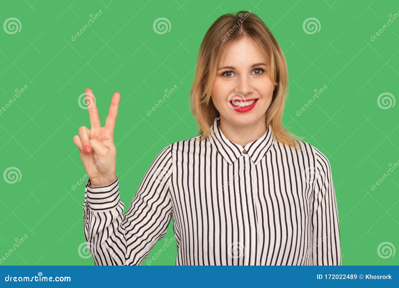 Portrait Of Happy Attractive Girl In Striped Blouse Showing Two Finger ...