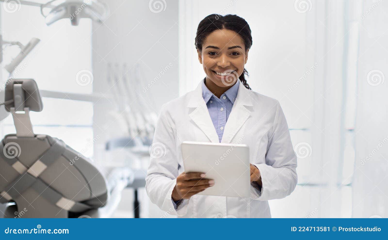 A Female Dentist Is Looking Into A Dental Microsco Royalty-Free Stock ...