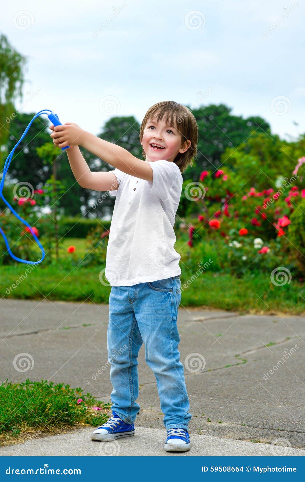 Portrait of Happy Boy Holding Skipping Rope Stock Photo - Image of