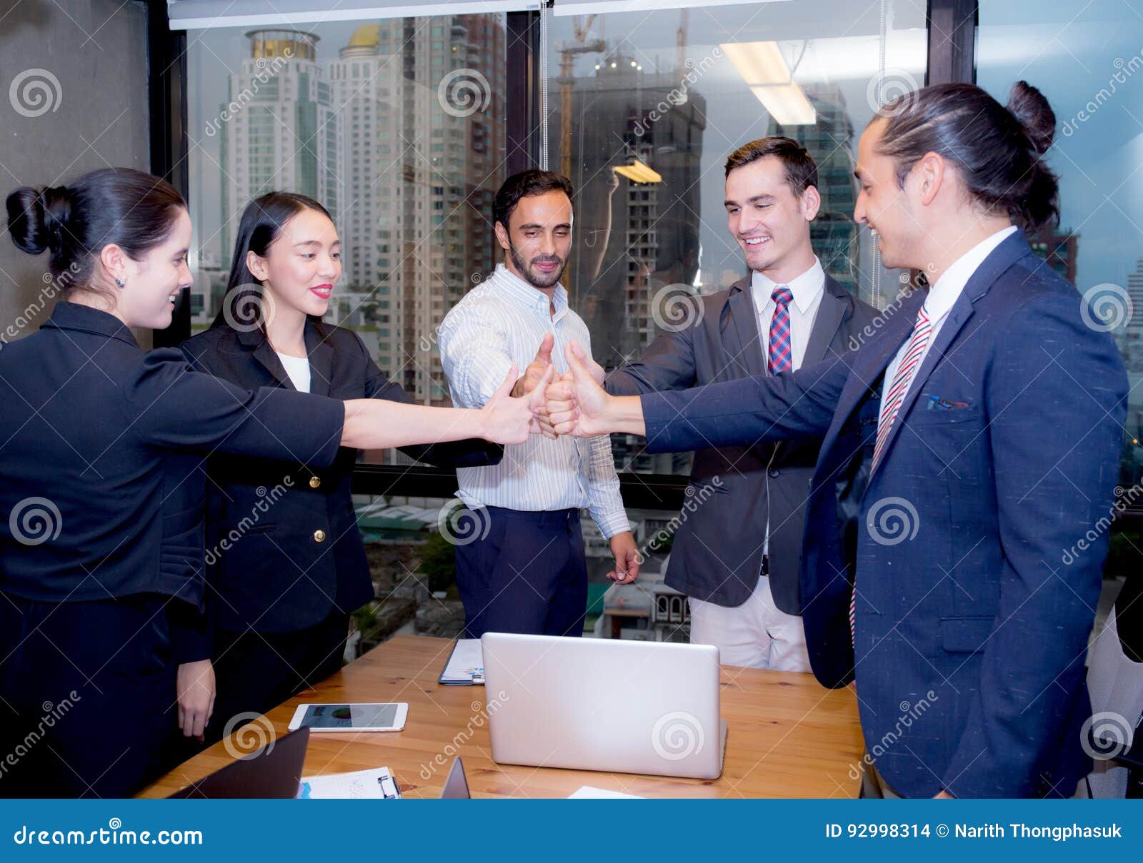 portrait of happy business partners with smile and geture of teamwork.