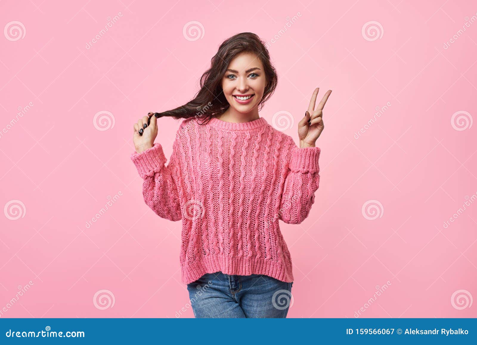 Portrait of a Happy Cheerful Girl Showing Peace Gesture with Hand ...