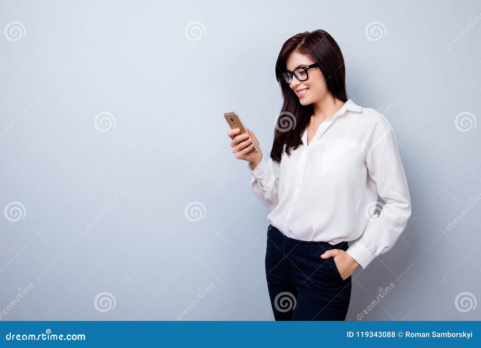 portrait of happy cheerful woman in formal suit standing with ha