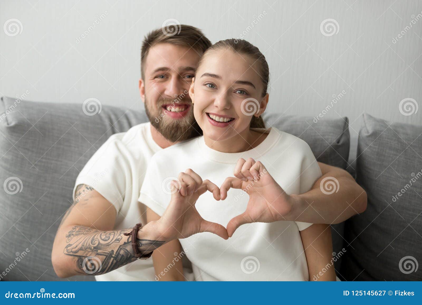 Side view of tender couple hugging and bonding with closed eyes in cold day  in mountains — people, sightseeing - Stock Photo | #328257096