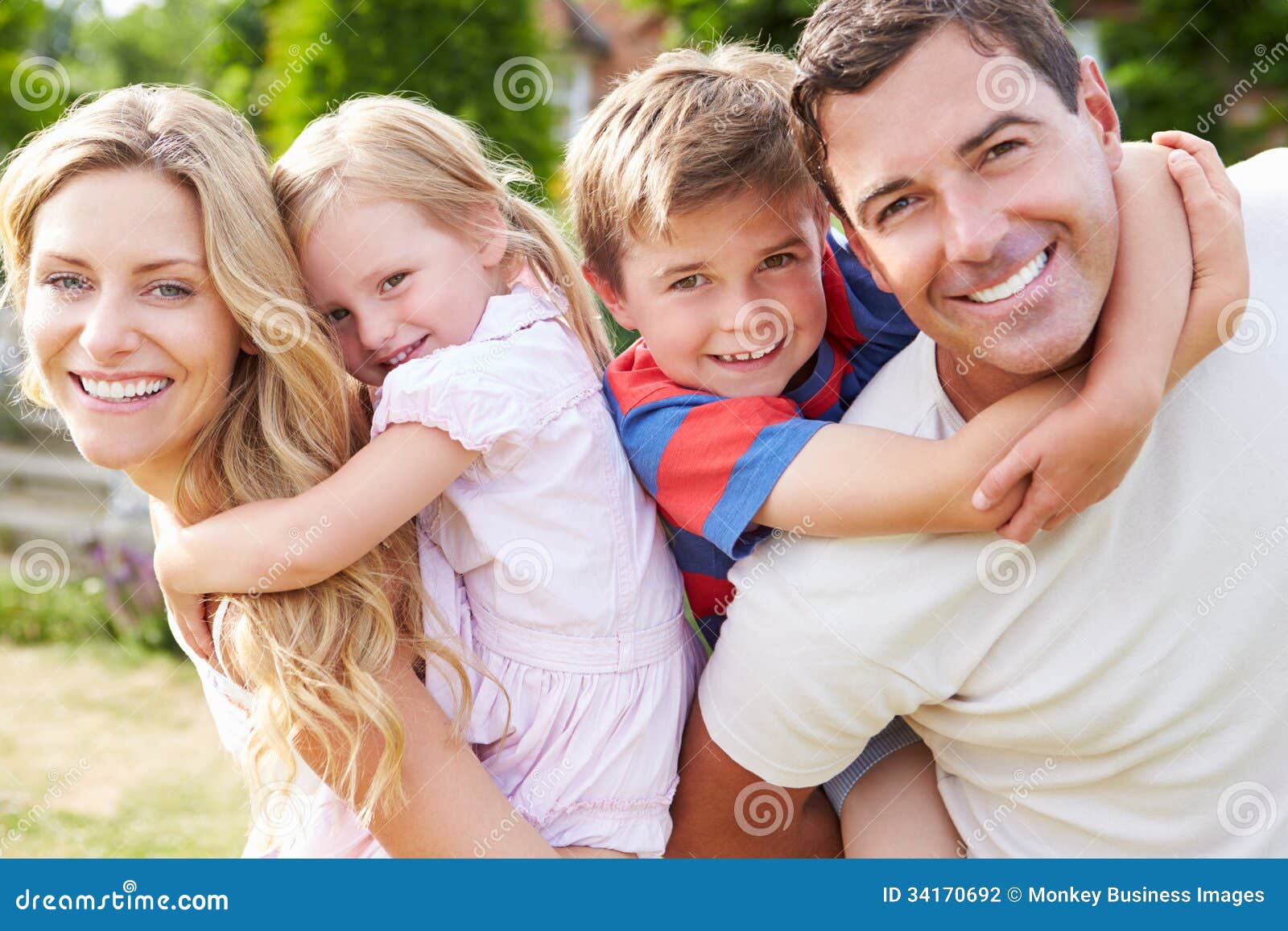 portrait of happy family in garden