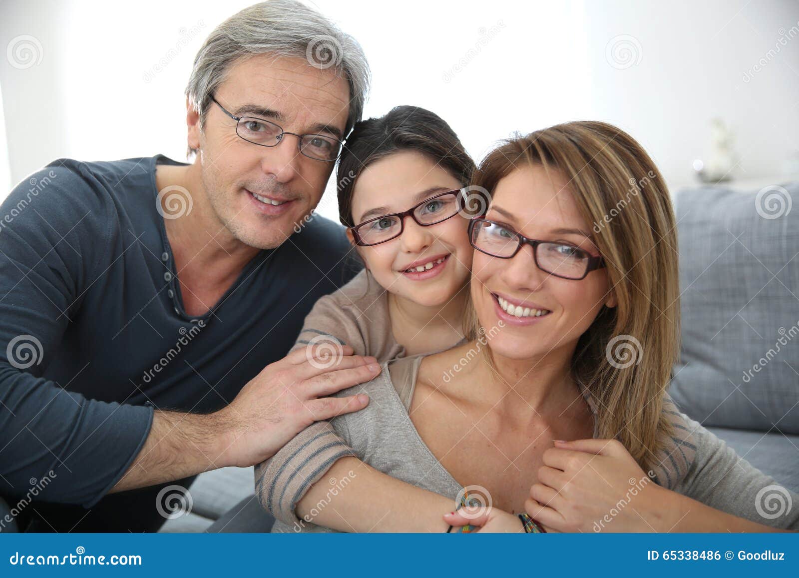 portrait of happy family wearing eyeglasses