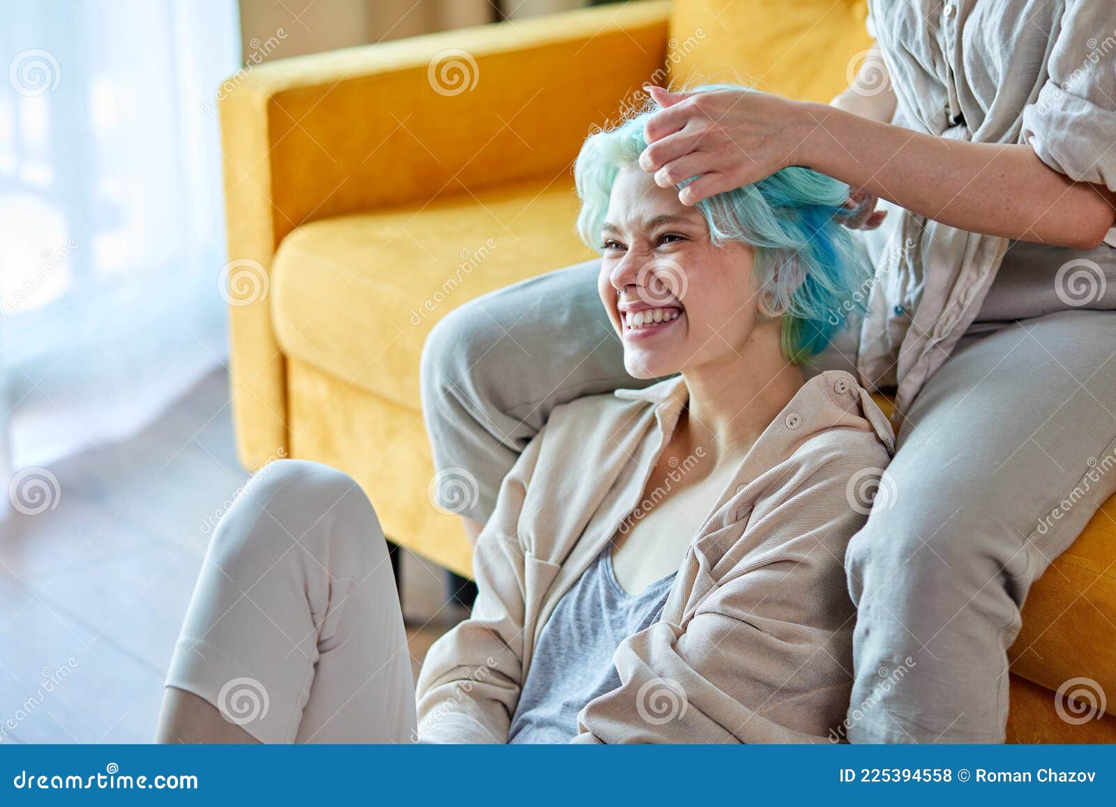 Portrait Of Positive Lesbian Couple Having Fun In Bright Cozy Room Together Lgbt Concept Stock